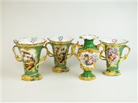 Lot 124 - Three Staffordshire green and lemon beaker vases together with similar further vase