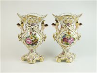 Lot 63 - A pair of Continental porcelain vases with caryatid handles