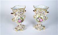Lot 63 - A pair of Continental porcelain vases with caryatid handles