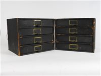 Lot 145 - A pair of four drawer desk filing units with brass handles