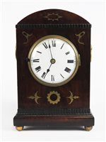 Lot 205 - A Regency mahogany and brass inlaid dome top mantel clock