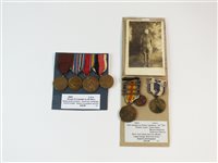 Lot 216 - United States of America World War I and II medals together with photograph and lapel badge