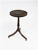 Lot 296 - A George III oak tripod table, the circular lipped top