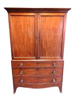 Lot 840 - A George III mahogany linen press