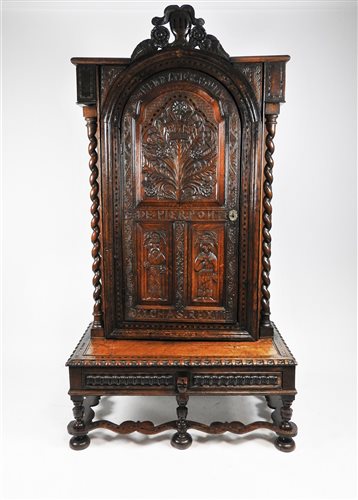 Lot 134 - A Victorian carved oak bookcase cabinet on stand