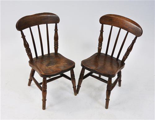 Lot 120 - A pair of children's beech framed kitchen chairs