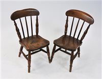 Lot 120 - A pair of children's beech framed kitchen chairs