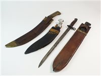 Lot 160 - A WWI bayonet with a machete and two kukri knives