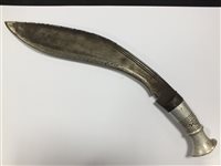 Lot 160 - A WWI bayonet with a machete and two kukri knives