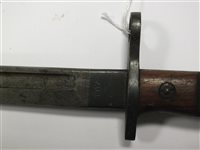Lot 160 - A WWI bayonet with a machete and two kukri knives