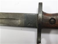 Lot 160 - A WWI bayonet with a machete and two kukri knives