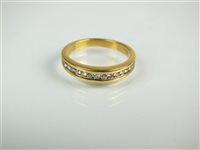 Lot 47 - A diamond set half hoop eternity ring