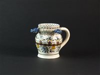 Lot 25 - A 19th century pearlware puzzle jug