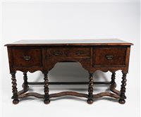Lot 140 - A figured walnut feather strung and cross banded dresser base