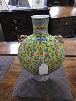 Lot 43 - A pair of lidded Chinese porcelain famille rose vases and one other