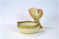 Lot 77 - A Royal Worcester blush ivory Nautilus shell and basket