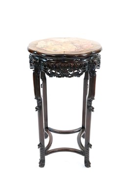 Lot 939 - An impressive 19th century Chinese carved hardwood marble topped jardinière stand