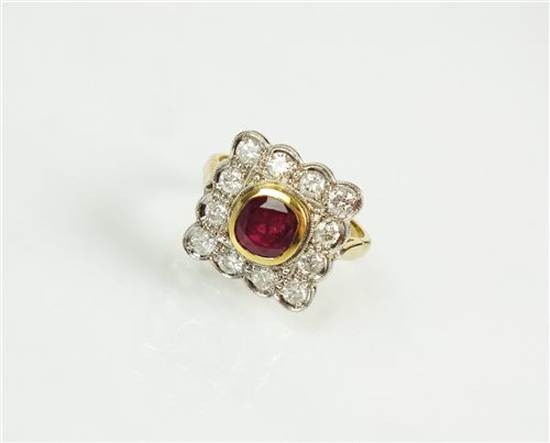 Lot 179 - A ruby and diamond cluster ring