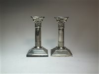 Lot 80 - A pair of Corinthian column silver candlesticks