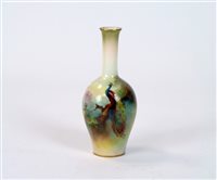 Lot 80 - A small Royal Worcester peacock vase