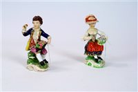 Lot 84 - A pair of Bloor Derby porcelain figures of male and female fruit vendors