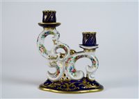 Lot 97 - A French porcelain double candlestick