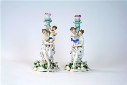 Lot 65 - A pair of German porcelain figural candlesticks