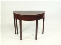Lot 825 - An Edwardian mahogany demi-lune tea table