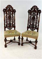 Lot 308 - A pair of William & Mary style carved oak high-back chairs with upholstered seats