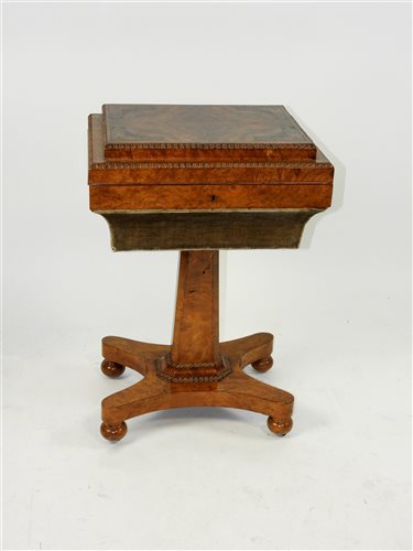 Lot 150 - An early Victorian figured walnut and inlaid sarcophagus shape work box
