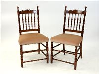 Lot 285 - A pair of Victorian stained beech spindle back chairs