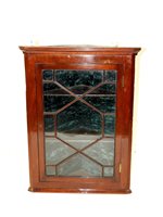 Lot 282 - A George III style mahogany corner cupboard