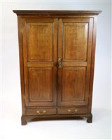 Lot 281 - A 19th century oak free standing hanging wardrobe