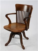 Lot 246 - An Edwardian oak swivel office chair