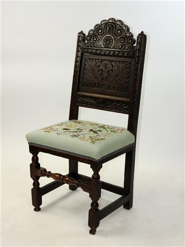 Lot 141 - A carved oak backstool 17th century