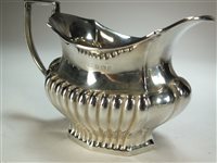 Lot 52 - A silver teapot and cream jug