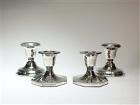 Lot 79 - Two pairs of silver mounted candlesticks