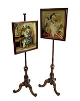 Lot 375 - A pair of Victorian rosewood telescopic pole screens mid-19th century