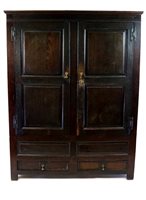 Lot 832 - An early 18th century oak press cupboard