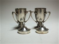 Lot 41 - A pair of silver pepperettes