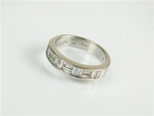 Lot 136 - A platinum diamond half eternity ring