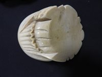 Lot 256 - A Japanese carved ivory figure of Hotei, Meiji period