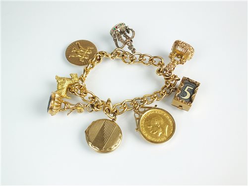 Lot 155 - An 18ct gold charm bracelet