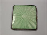 Lot 19 - An Art Deco silver and green guilloche enamel cigarette case
