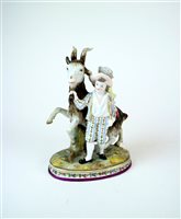 Lot 131 - A Derby style figure group of children with a goat