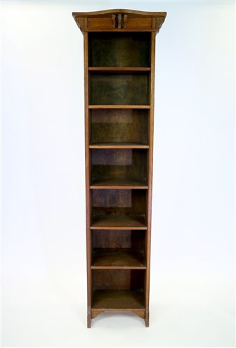 Lot 380 - An oak Arts and Crafts tall narrow bookcase