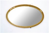 Lot 345 - A gesso framed oval wall mirror