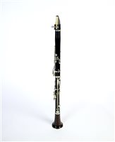 Lot 286 - An unboxed French three sectional polished hardwood clarinet