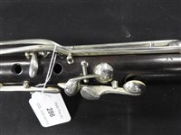 Lot 286 - An unboxed French three sectional polished hardwood clarinet