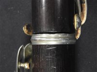 Lot 286 - An unboxed French three sectional polished hardwood clarinet